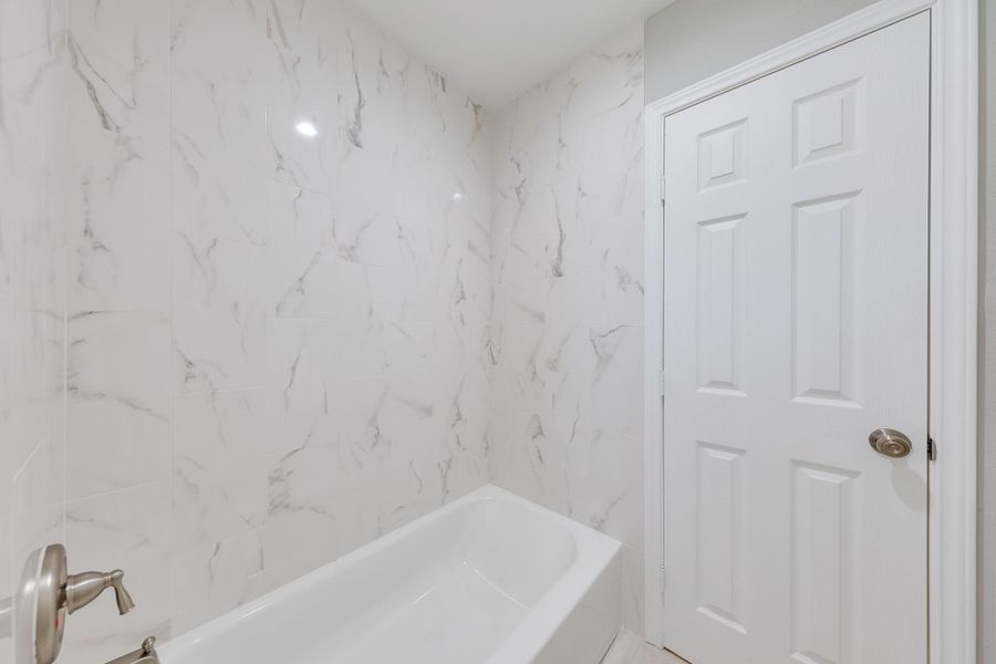 Private Toilet and Tub-Shower Combo: The primary bath features a private toilet area for added convenience and privacy, along with a sleek tub-shower combo. Private Toilet and Tub-Shower Combo: The primary bath features a private toilet area for added convenience and privacy, along with a sleek tub-shower combo.