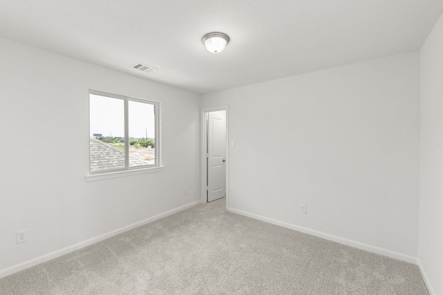 Spacious, unfurnished interior of a new home in The Reserve at Spiritas Ranch, Little Elm (Image 31).
