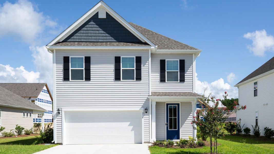 Front exterior of a new home in Surfside Landing, Hubert, NC, highlighting curb appeal (Image 1).