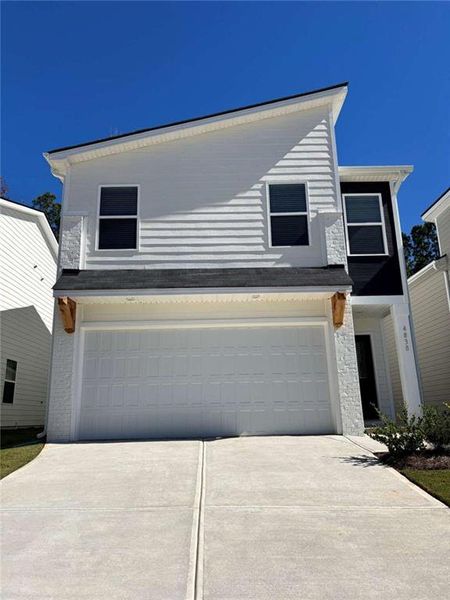 Front exterior of a new home in Stonewall Station, Union City, GA, highlighting curb appeal (Image 1). Front exterior of a new home in Stonewall Station, Union City, GA, highlighting curb appeal (Image 1).