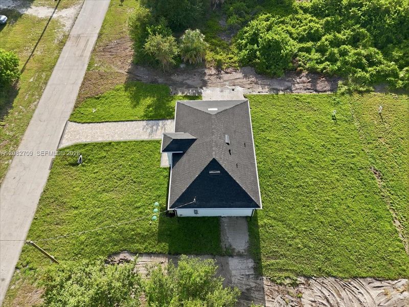 Front exterior of a new home in , Lehigh Acres, FL, highlighting curb appeal (Image 26).