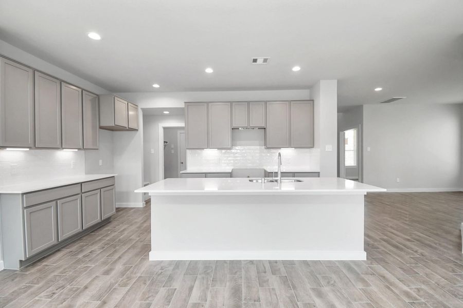 Massive Island at the focal point. Sample photo of completed home with similar floor plan. Actual colors and selections may vary.