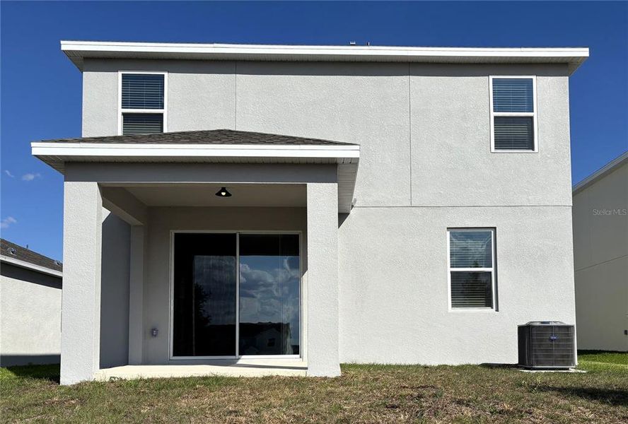 Exterior details and patio area of a home in Trinity Lakes, Groveland (Image 3).
