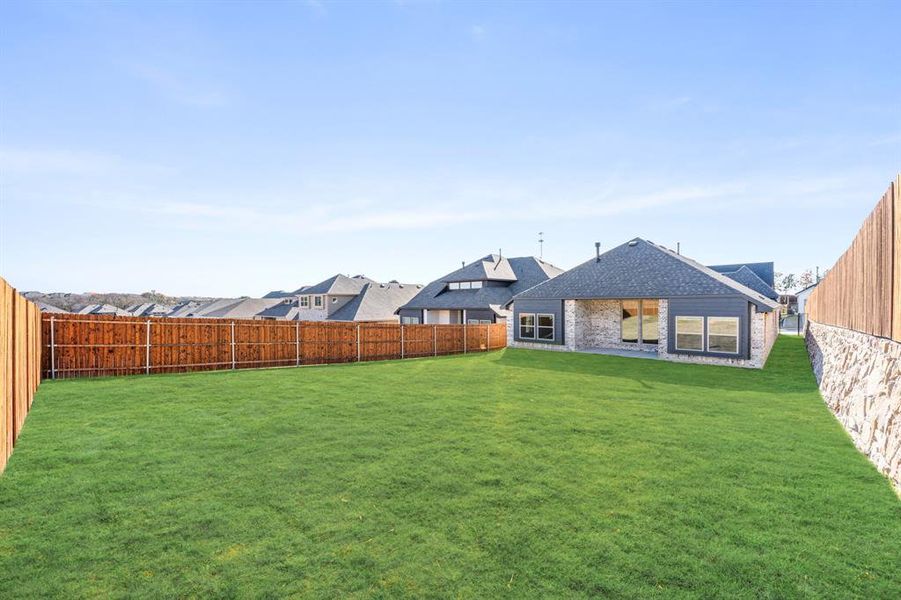 Exterior details and patio area of a home in The Lakes at Parks of Aledo, Aledo (Image 26).