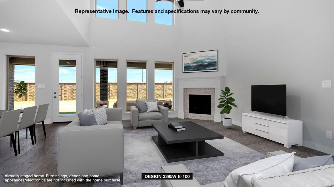 Living room with ceiling fan, a fireplace, a high ceiling, and wood finished floors