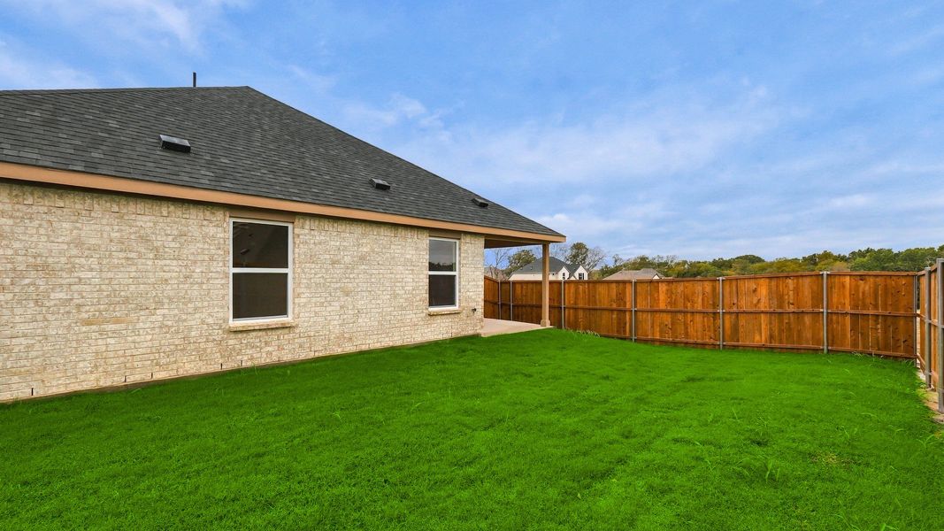 Exterior details and patio area of a home in Thompson Farms, Van Alstyne (Image 26). Exterior details and patio area of a home in Thompson Farms, Van Alstyne (Image 26).