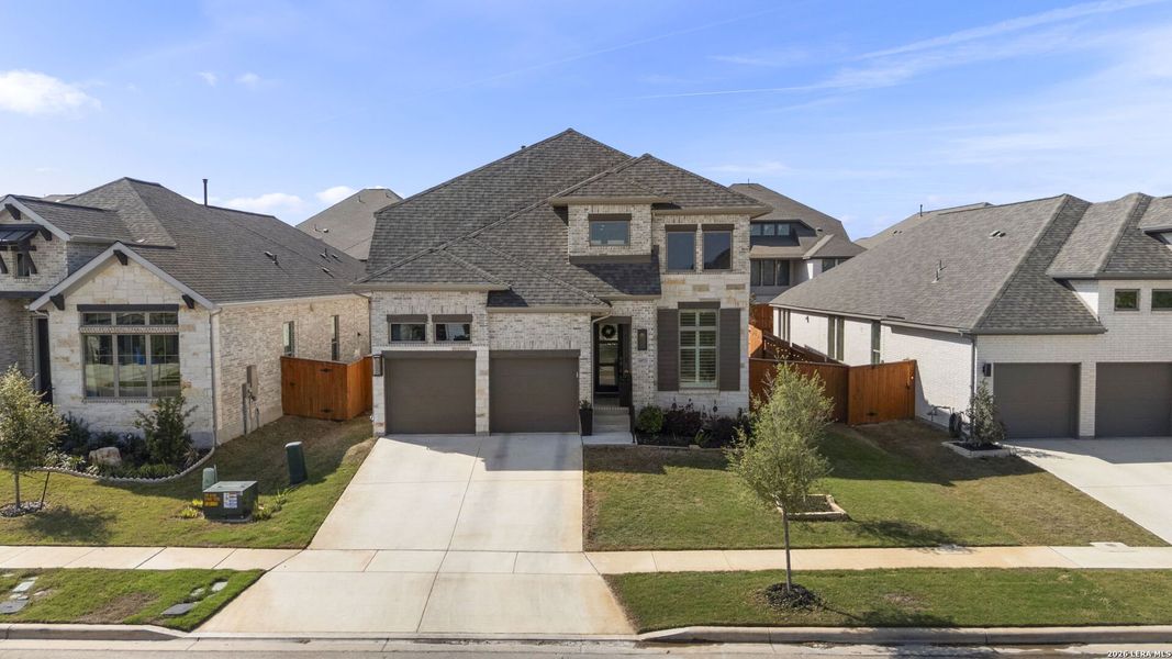 Front exterior of a new home in Veramendi, New Braunfels, TX, highlighting curb appeal (Image 22).