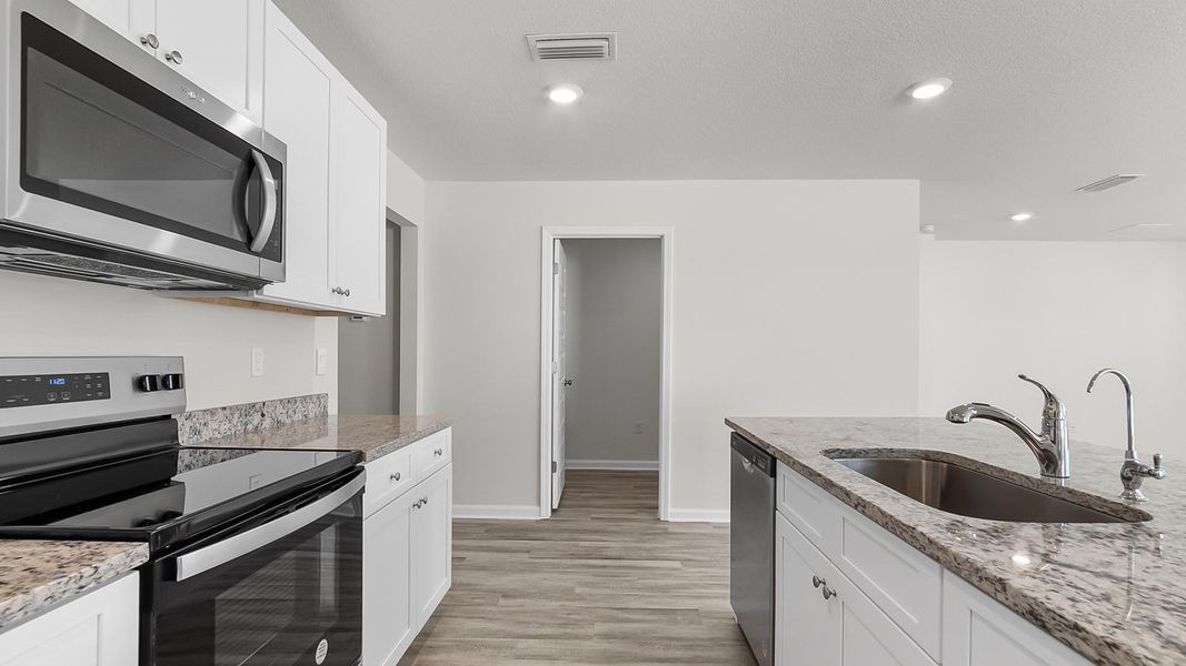 Furnished interior view inside a new home in Sunny Hills, Chipley (Image 5).