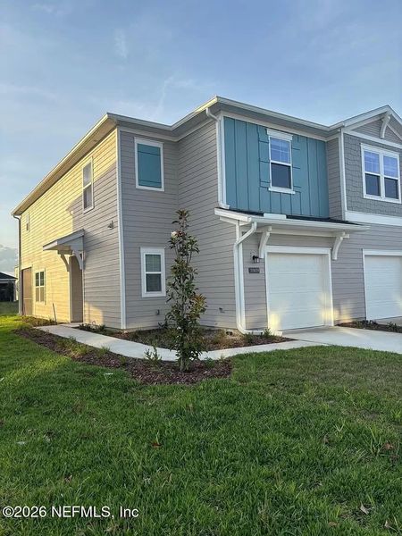 Front exterior of a new home in , Jacksonville, FL, highlighting curb appeal (Image 14).