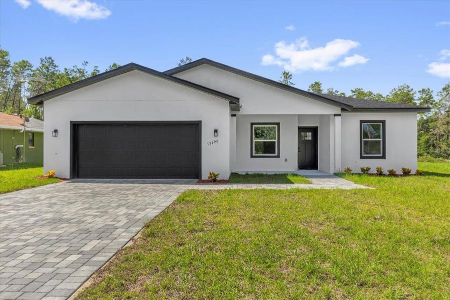 Front exterior of a new home in , Ocala, FL, highlighting curb appeal (Image 20).