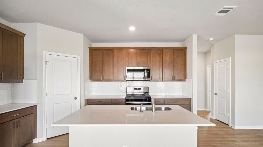Furnished interior view inside a new home in Carillon, Manor (Image 5).