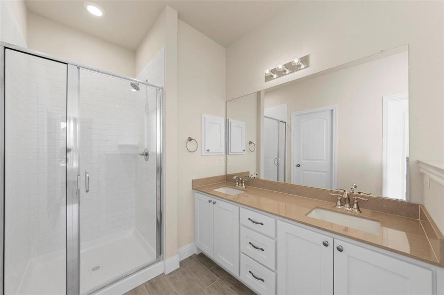 Bathroom featuring vanity and walk in shower