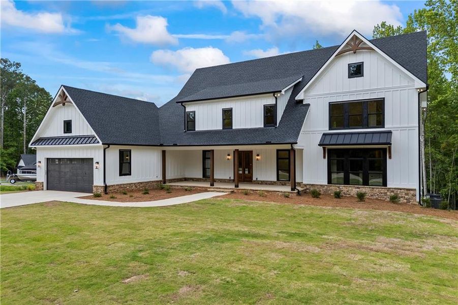 Front exterior of a new home in , Flowery Branch, GA, highlighting curb appeal (Image 35).
