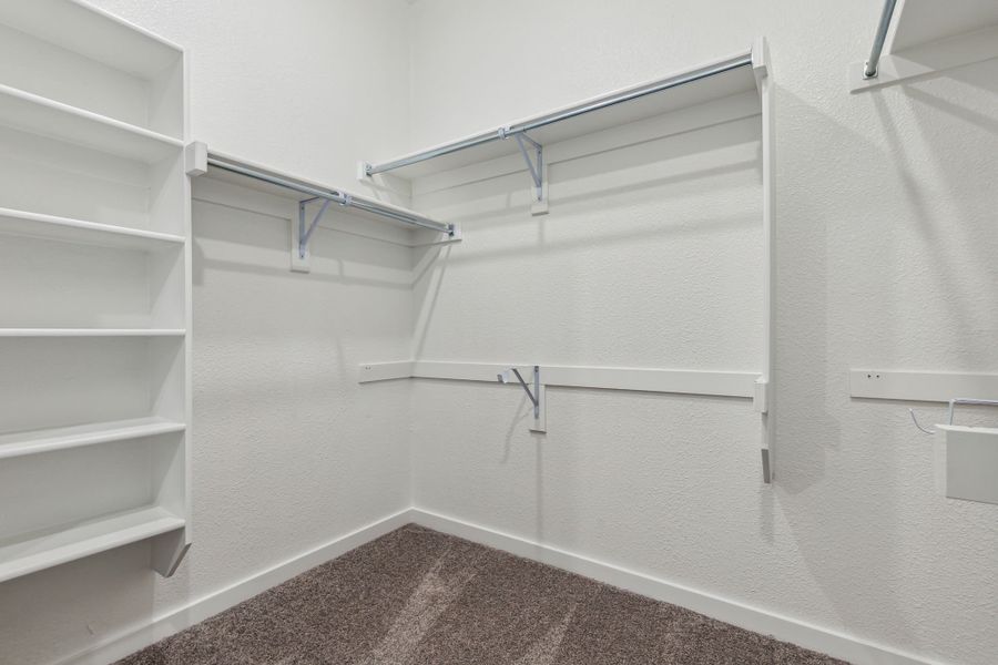 Primary Closet in the Jade II home plan by Trophy Signature Homes – REPRESENTATIVE PHOTO Primary Closet in the Jade II home plan by Trophy Signature Homes – REPRESENTATIVE PHOTO