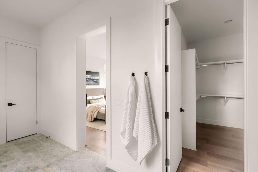 Ensuite bathroom featuring a spacious closet Ensuite bathroom featuring a spacious closet