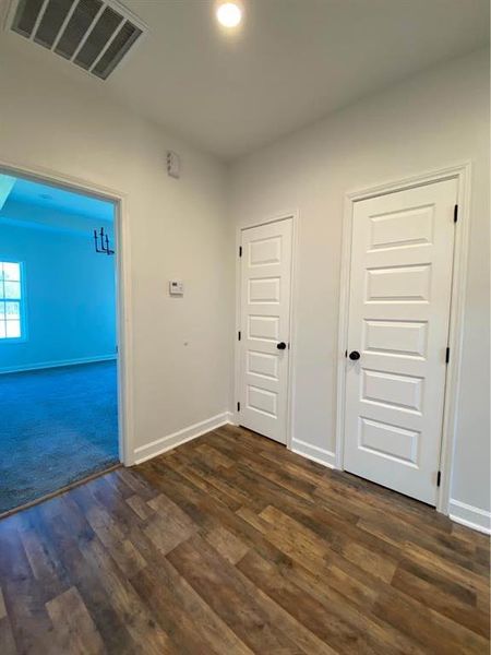 Spare room with dark hardwood / wood-style floors