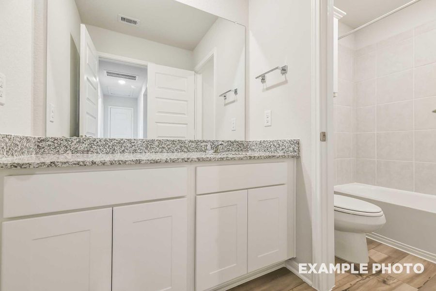 Furnished interior view inside a new home in Caney Creek Place, Conroe (Image 11).