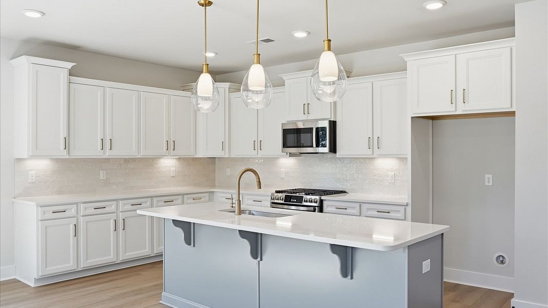 Elegant and center island anchors this tasteful kitchen with high standards and timeless appeal at Benjamin's Grove Elegant and center island anchors this tasteful kitchen with high standards and timeless appeal at Benjamin's Grove