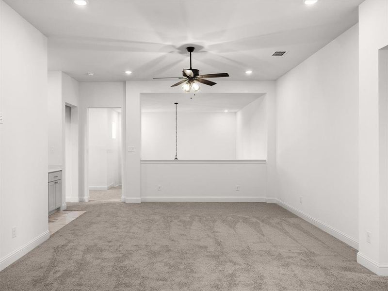 Unfurnished room featuring light colored carpet, recessed lighting, and ceiling fan