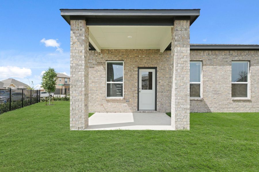Exterior details and patio area of a home in Creekland Village at Bridgeland, Cypress (Image 3).