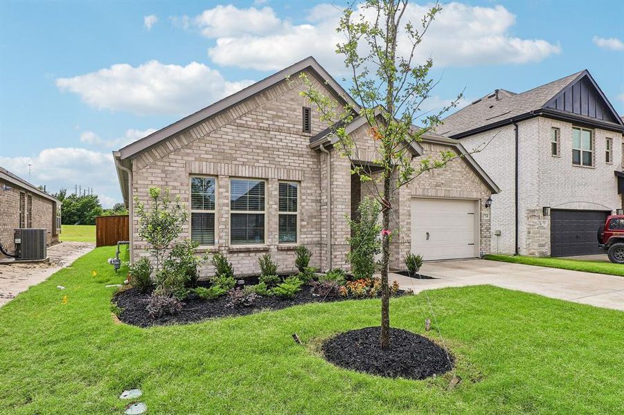 Front exterior of a new home in Elevon, Lavon, TX, highlighting curb appeal (Image 1). Front exterior of a new home in Elevon, Lavon, TX, highlighting curb appeal (Image 1).