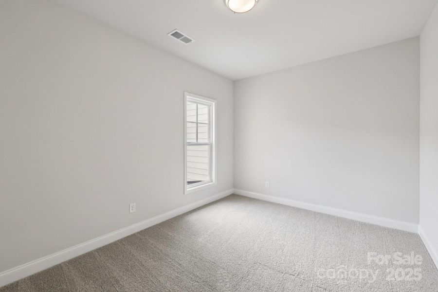Spacious, unfurnished interior of a new home in Walk23, Huntersville (Image 32).