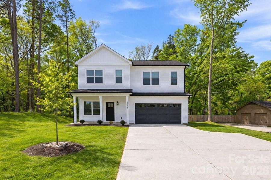 Front exterior of a new home in , Charlotte, NC, highlighting curb appeal (Image 26).