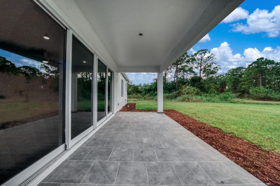 Exterior details and patio area of a home in , Lake Placid (Image 3).