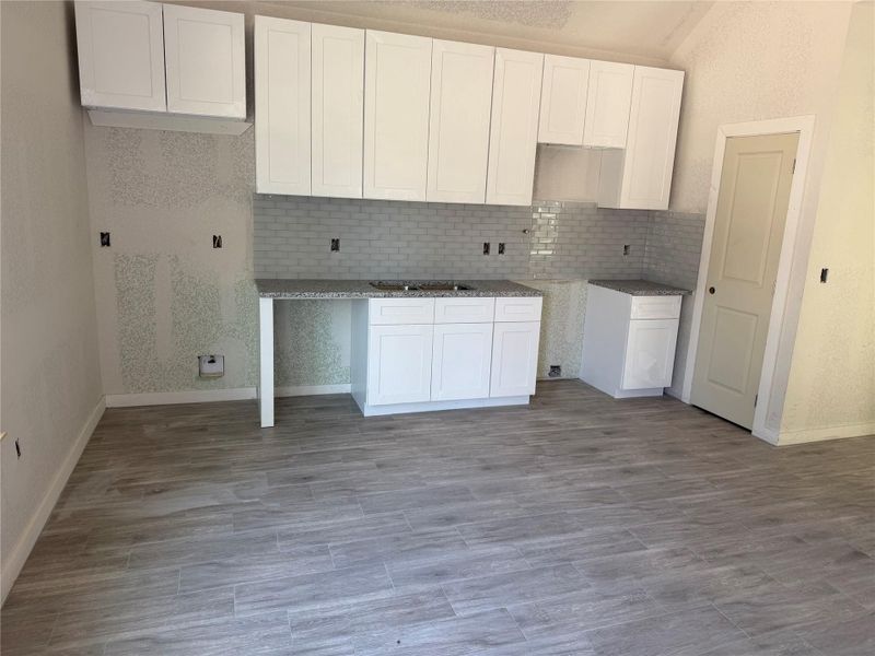 Actual kitchen showing flooring and cabinets Actual kitchen showing flooring and cabinets
