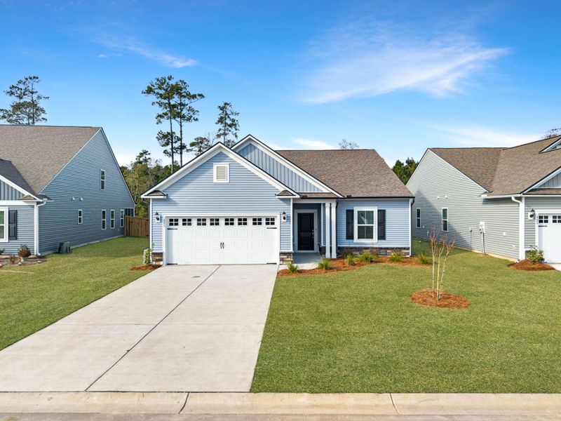 Front exterior of a new home in Eagle Run, Carolina Shores, NC, highlighting curb appeal (Image 2). Front exterior of a new home in Eagle Run, Carolina Shores, NC, highlighting curb appeal (Image 2).