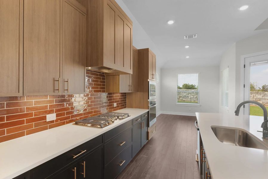 Representative furnished interior of a home built from the Brooks by Chesmar Homes in University Heights, McKinney (Image 7).