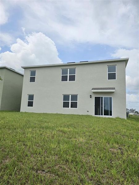 Front exterior of a new home in , Haines City, FL, highlighting curb appeal (Image 1).