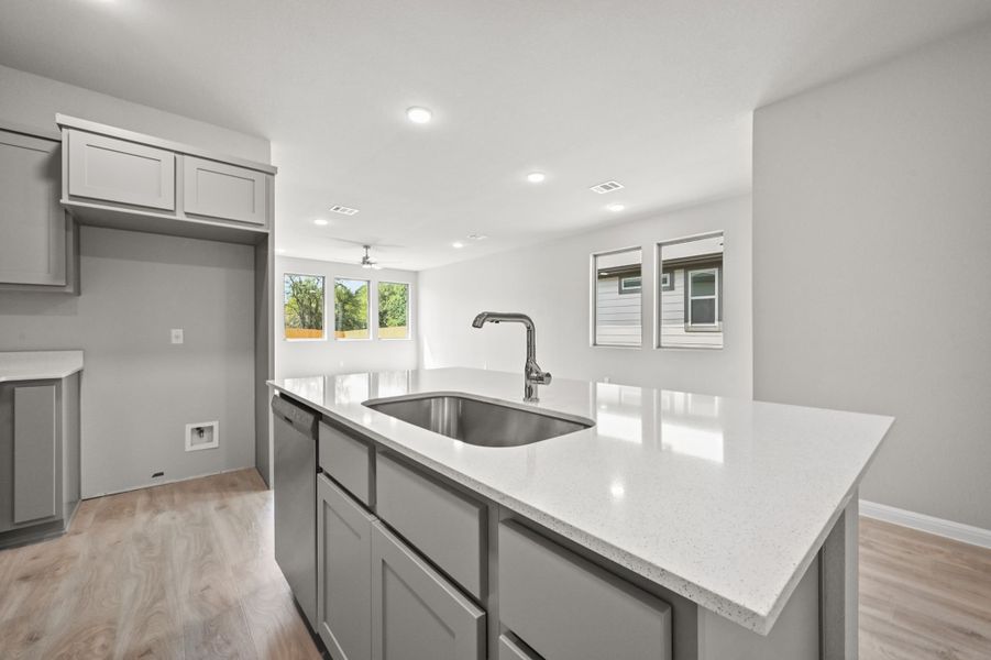 Kitchen in the Willow home plan by Trophy Signature Homes – REPRESENTATIVE PHOTO