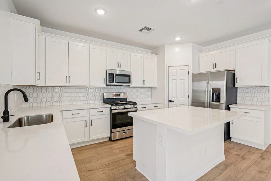 Kitchen. Not actual home, finishes and options may vary.