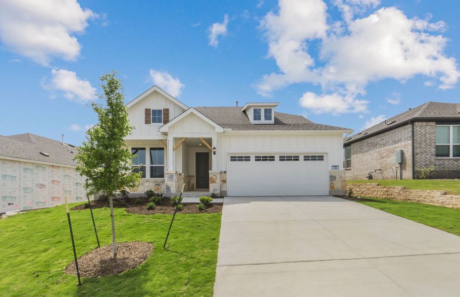 Front exterior of a new home in Sun City Texas, Georgetown, TX, highlighting curb appeal (Image 22).