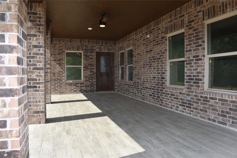 Sample of Home CLOSE UP OF THE BACK PORCH WITH TILED FLOORING.