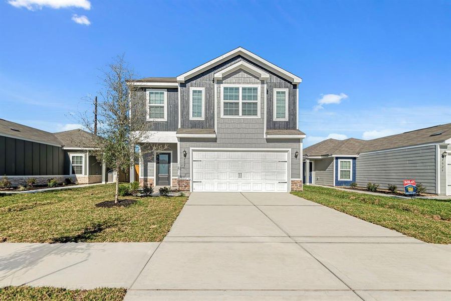 Imagine pulling up in the driveway of this beautiful, modern two-story home.