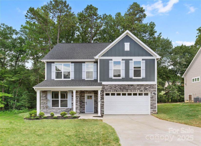 Front exterior of a new home in , Hickory, NC, highlighting curb appeal (Image 22).