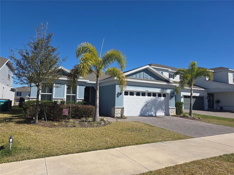 Front exterior of a new home in , Montverde, FL, highlighting curb appeal (Image 15). Front exterior of a new home in , Montverde, FL, highlighting curb appeal (Image 15).