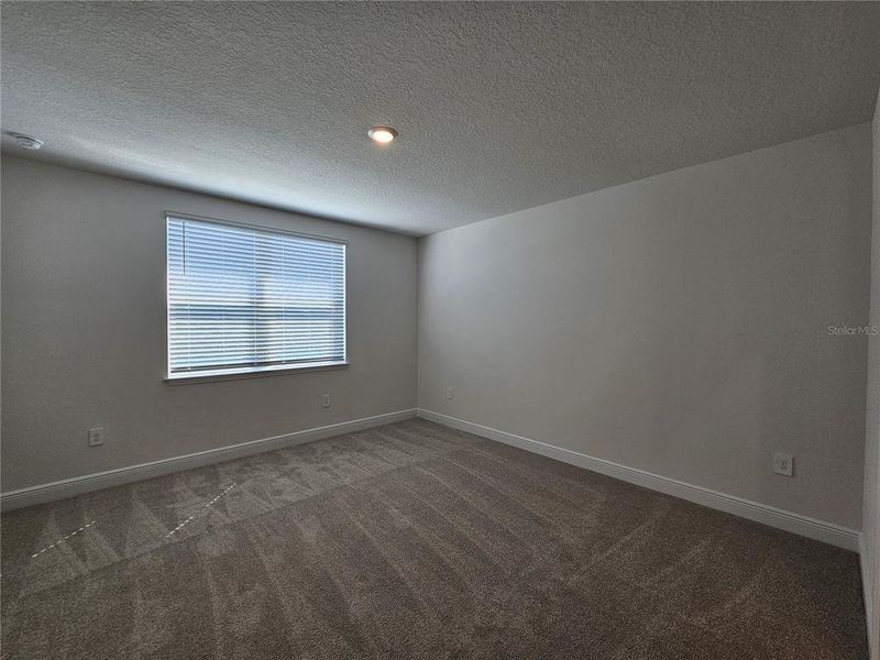 Spacious, unfurnished interior of a new home in The Reserve at Hammock Oaks - Signature Series, Lady Lake (Image 34).