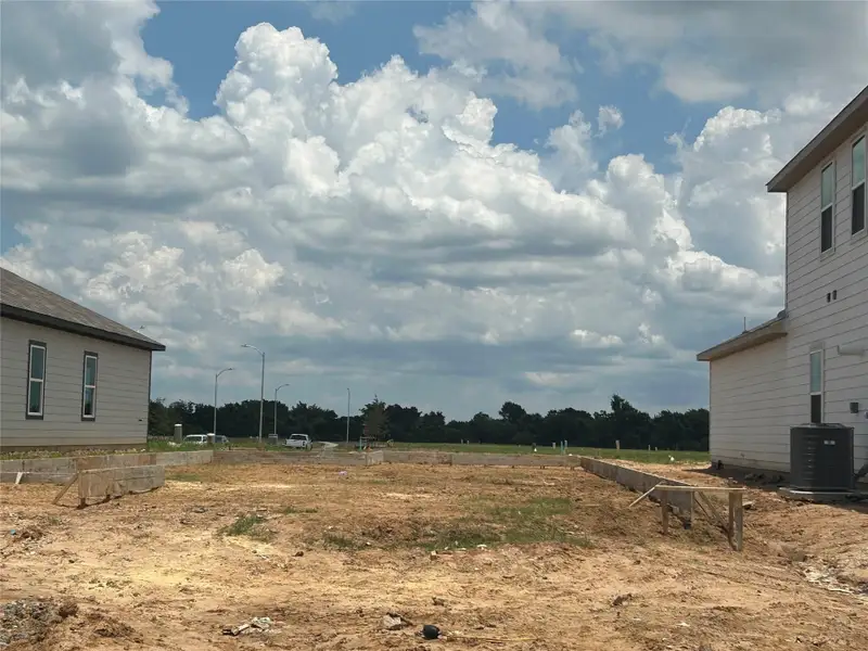 Front exterior of a new home in Lonestar Collection at Paloma at Sanford Farms, Waller, TX, highlighting curb appeal (Image 10).