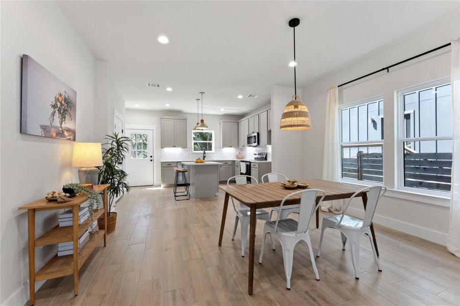 Open to the kitchen and living room, creating an easy, connected flow for everyday living and entertaining.