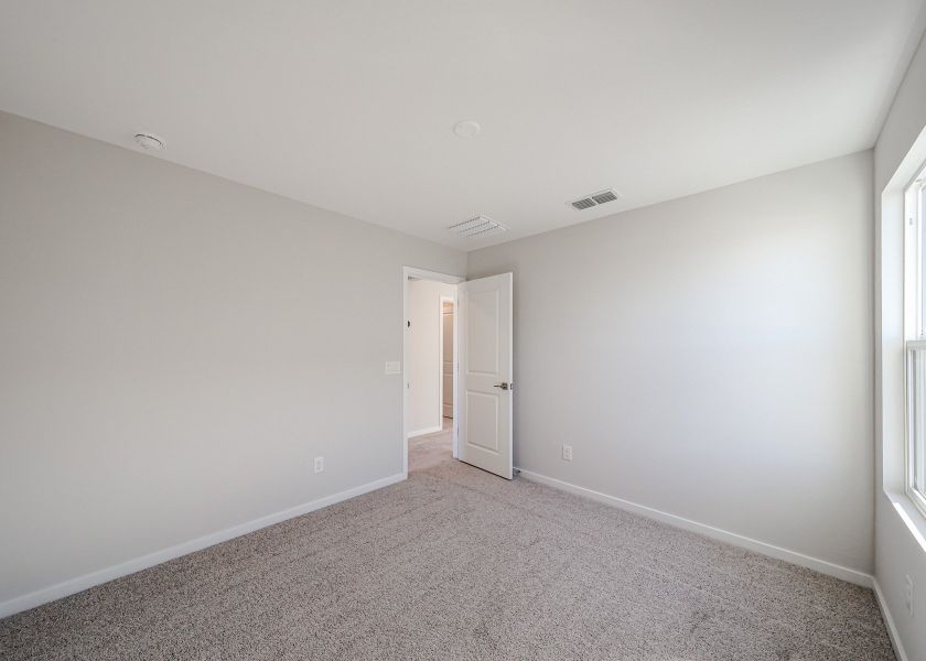 A hallway with white walls.