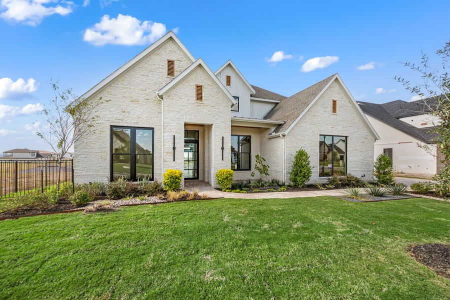 Front exterior of a new home in The Resort on Eagle Mt. Lake, Fort Worth, TX, highlighting curb appeal (Image 28).