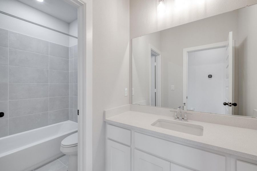 Furnished interior view inside a new home in The Colony, Bastrop (Image 12).