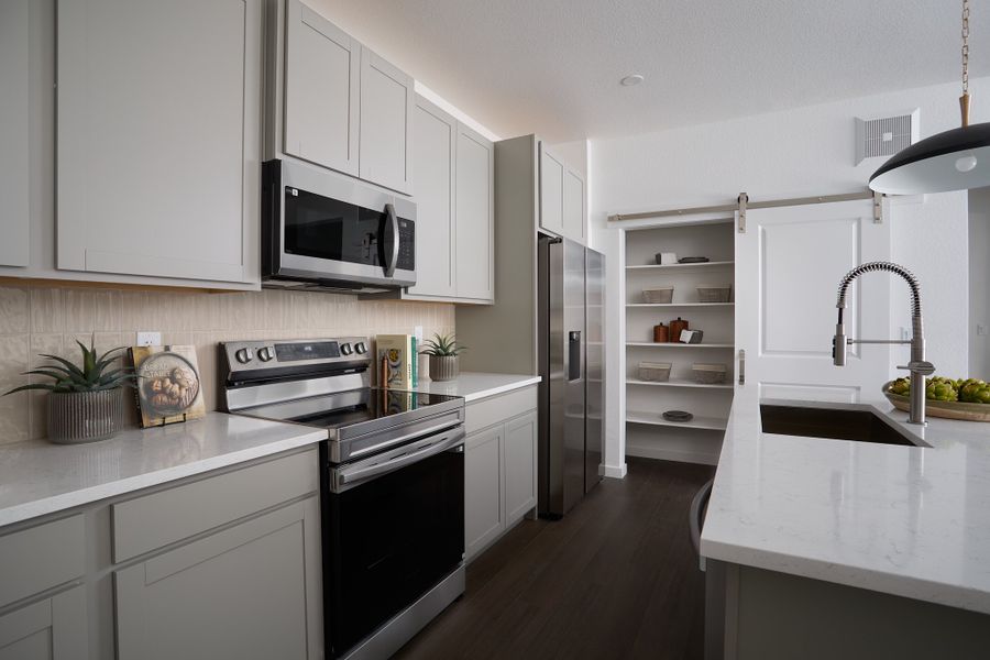 Furnished interior view inside a new home in Lyric at RidgeGate Condos, Lone Tree (Image 3).