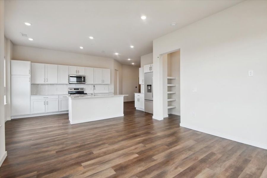 A kitchen with white cabinets. A kitchen with white cabinets.