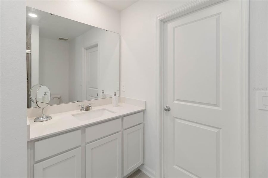 Furnished interior view inside a new home in Peace Creek Reserve: Manor Key Collection, Winter Haven (Image 21).