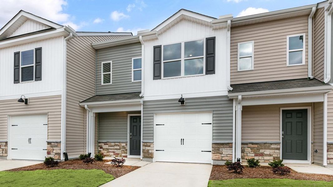 Front exterior of a new home in The Townes at Honeycutt Oaks, Angier, NC, highlighting curb appeal (Image 1). Front exterior of a new home in The Townes at Honeycutt Oaks, Angier, NC, highlighting curb appeal (Image 1).