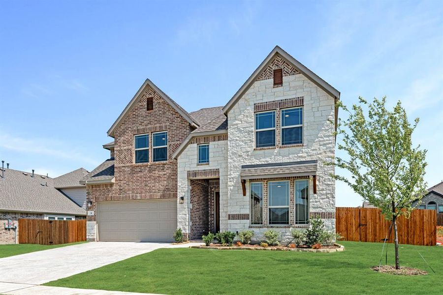 Front exterior of a new home in Sable Creek, Sanger, TX, highlighting curb appeal (Image 1). Front exterior of a new home in Sable Creek, Sanger, TX, highlighting curb appeal (Image 1).